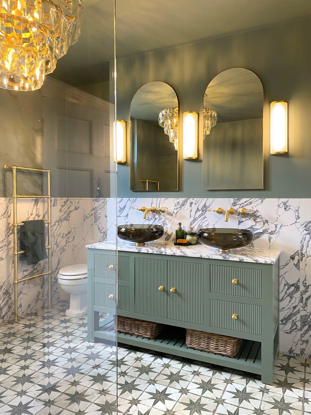 vanity unit with mirrors and wall lights